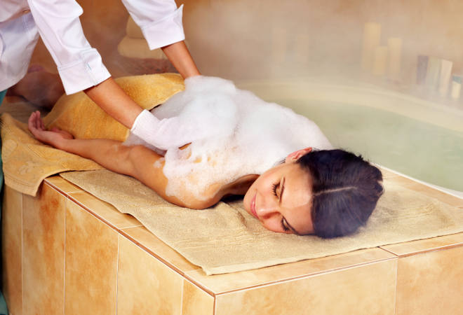 Young woman in hammam or turkish bath.